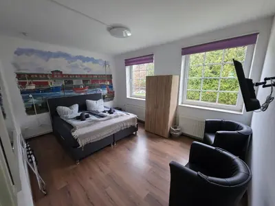 Ein Bett oder Betten in einem Zimmer der Unterkunft Gästehaus Strandbake