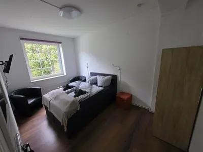 Ein Bett oder Betten in einem Zimmer der Unterkunft Gästehaus Strandbake