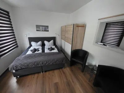 Ein Bett oder Betten in einem Zimmer der Unterkunft Gästehaus Strandbake
