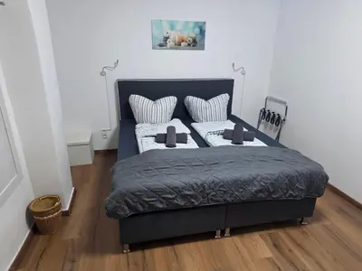 Ein Bett oder Betten in einem Zimmer der Unterkunft Gästehaus Strandbake