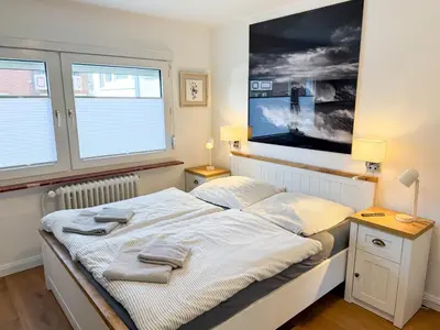 Ein Bett oder Betten in einem Zimmer der Unterkunft Haus Meereswoge