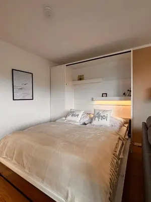 Ein Bett oder Betten in einem Zimmer der Unterkunft Haus Poseidon, Ferienwohnung POS33