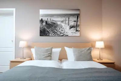 Ein Bett oder Betten in einem Zimmer der Unterkunft Hotel Kleiner Yachthafen