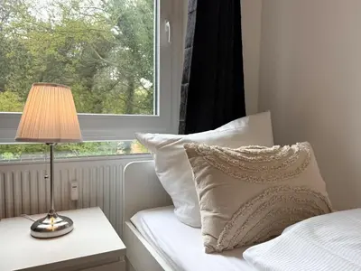 Ein Bett oder Betten in einem Zimmer der Unterkunft Seaside 53° FeWo 1