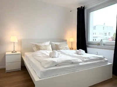 Ein Bett oder Betten in einem Zimmer der Unterkunft Seaside 53° FeWo 1