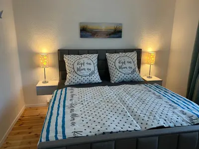 Ein Bett oder Betten in einem Zimmer der Unterkunft Fewo Auszeit am Meer