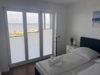 Ein Bett oder Betten in einem Zimmer der Unterkunft Duhner Spitze Wohnung 12