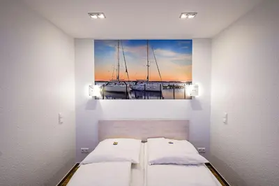 Ein Bett oder Betten in einem Zimmer der Unterkunft Strandhochhaus SHC5