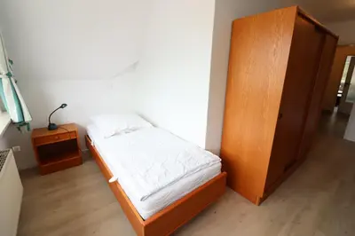 Ein Bett oder Betten in einem Zimmer der Unterkunft Itjen am Strand Wohnung 1 Grün