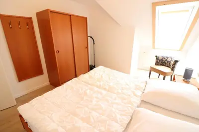 Ein Bett oder Betten in einem Zimmer der Unterkunft Itjen am Strand Wohnung 1 Grün