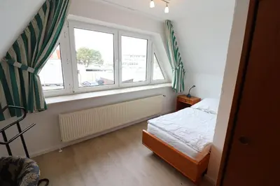 Ein Bett oder Betten in einem Zimmer der Unterkunft Itjen am Strand Wohnung 1 Grün