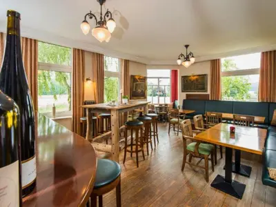 Ein Restaurant oder anderes Speiselokal in der Unterkunft Peters - das Genusshotel in der Wingst