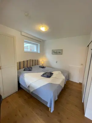 Ein Bett oder Betten in einem Zimmer der Unterkunft 
