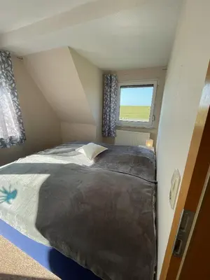 Ein Bett oder Betten in einem Zimmer der Unterkunft 
