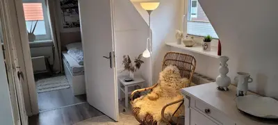 Ein Sitzbereich in der Unterkunft Büsumhaus Birgit