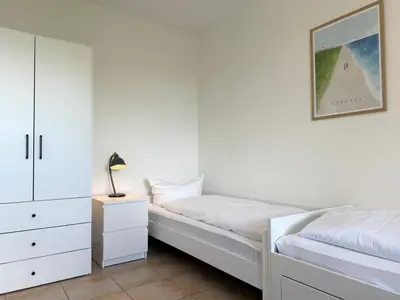 Ein Bett oder Betten in einem Zimmer der Unterkunft Haus am Waldbad FeWo 2