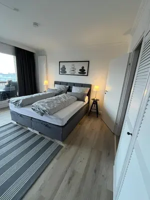 Ein Bett oder Betten in einem Zimmer der Unterkunft Fewo Schröder - Pier 5 - Strandkorb am Meer - seitlicher Meerblick - inklusiv Bettwäsche und Handtücher