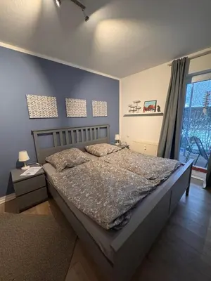 Ein Bett oder Betten in einem Zimmer der Unterkunft Ferienwohnung in Dorum