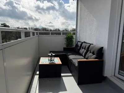 Ein Sitzbereich in der Unterkunft Strandleev - strandnahe Ferienwohnung inklusive Saisonstrandkorb mit 3 Schlafzimmern in Duhnen