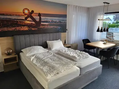Ein Bett oder Betten in einem Zimmer der Unterkunft ANKERGLÜCK inkl Ebikes