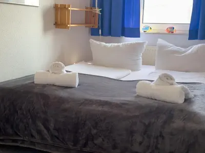 Ein Bett oder Betten in einem Zimmer der Unterkunft Haus Seewind Wohnung 3