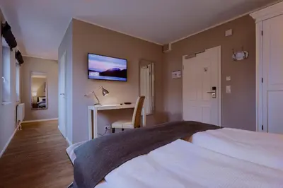 Ein Bett oder Betten in einem Zimmer der Unterkunft Hotel Astra Maris