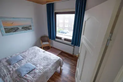 Ein Bett oder Betten in einem Zimmer der Unterkunft Haus Kehrwieder Wohnung Nordsee