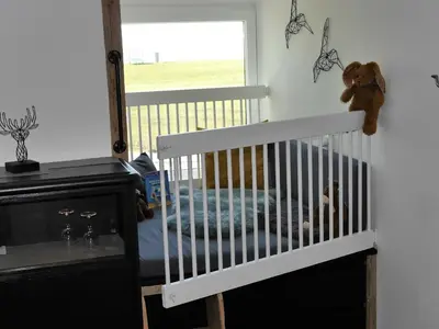 Ein Bett oder Betten in einem Zimmer der Unterkunft Ferienwohnung Deichbude 13 im Hochhaus