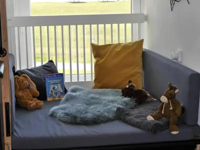 Ein Bett oder Betten in einem Zimmer der Unterkunft Ferienwohnung Deichbude 13 im Hochhaus