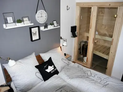 Ein Bett oder Betten in einem Zimmer der Unterkunft Ferienwohnung Deichbude 13 im Hochhaus