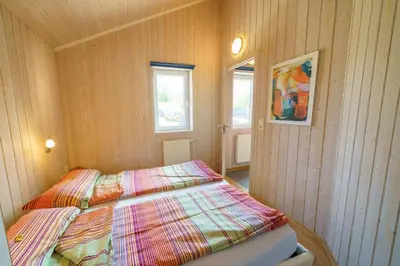 Ein Bett oder Betten in einem Zimmer der Unterkunft Ferienhaus Kum Weer
