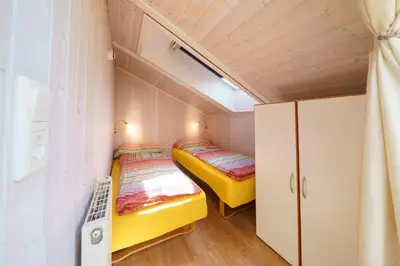 Ein Bett oder Betten in einem Zimmer der Unterkunft Ferienhaus Kum Weer