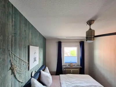Ein Bett oder Betten in einem Zimmer der Unterkunft Nordseeblick