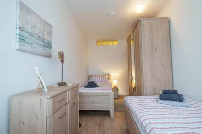 Ein Bett oder Betten in einem Zimmer der Unterkunft Perle am Meer