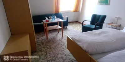 Ein Bett oder Betten in einem Zimmer der Unterkunft Gasthaus zur Grenze