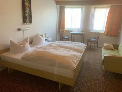 Ein Bett oder Betten in einem Zimmer der Unterkunft Gasthaus zur Grenze