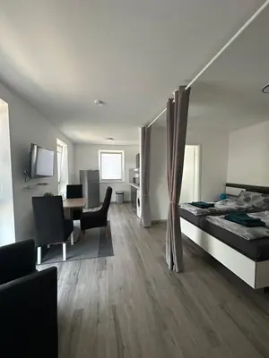 Ein Bett oder Betten in einem Zimmer der Unterkunft Star Ferien Appartement