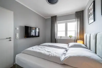 Ein Bett oder Betten in einem Zimmer der Unterkunft Haus Sturmkieker Apartment Penthouse 1 2