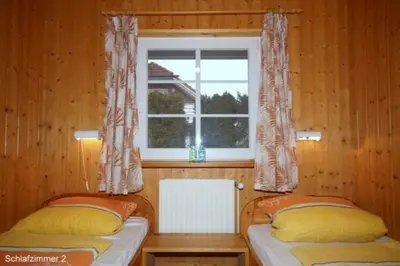 Ein Bett oder Betten in einem Zimmer der Unterkunft 4 Personen Ferienhaus mit Carport in Otterndorf