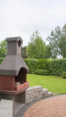 Ein Garten an der Unterkunft 4 Personen Ferienhaus, Garten mit Zaun und Tor