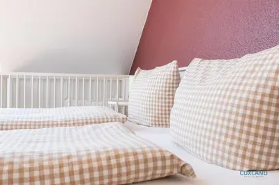 Ein Bett oder Betten in einem Zimmer der Unterkunft Ferienhaus Bremer Str 6