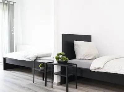 Ein Bett oder Betten in einem Zimmer der Unterkunft Brunsbüttel City Apartments