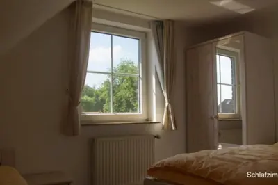 Ein Bett oder Betten in einem Zimmer der Unterkunft 4 Personen Ferienhaus mit zwei Toiletten in Otterndorf