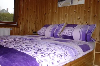 Ein Bett oder Betten in einem Zimmer der Unterkunft 4 Personen Ferienhaus mit 3 Schlafzimmern in Otterndorf
