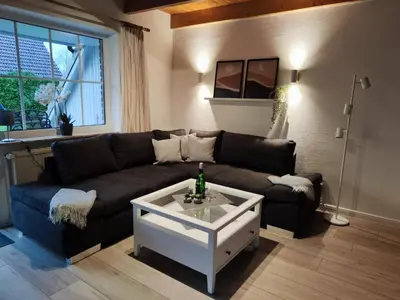 Ein Sitzbereich in der Unterkunft 4 Personen Ferienhaus mit zwei Toiletten in Otterndorf