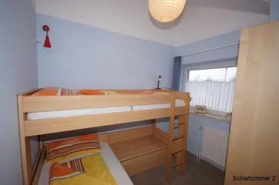 Ein Bett oder Betten in einem Zimmer der Unterkunft 4 Personen Ferienhaus mit Kanu, Kaminofen und herrlichem Seeblick in Otterndorf
