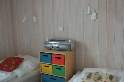 Ein Bett oder Betten in einem Zimmer der Unterkunft 4 Personen Ferienhaus mit Sauna und herrlichem Blick auf den See in Otterndorf