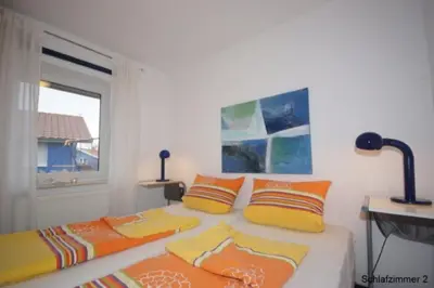 Ein Bett oder Betten in einem Zimmer der Unterkunft 6 Personen Ferienhaus mit privatem Bootsteg, direkter Seelage, Kanu, Sauna und Badewanne in Otterndorf