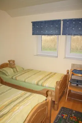 Ein Bett oder Betten in einem Zimmer der Unterkunft 4 Personen Ferienhaus mit Sauna und zwei Toiletten in Otterndorf