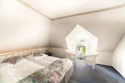Ein Bett oder Betten in einem Zimmer der Unterkunft Ferienanlage Duhnen Haus 23